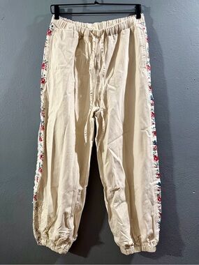 NWOT. POL Cream Drawstring Joggers with Floral Side Trim